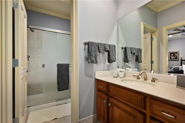 full bath with crown molding, vanity, and a stall shower