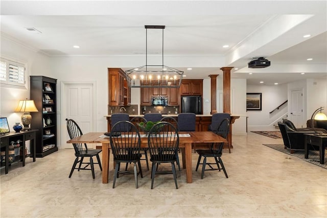 dining space featuring recessed lighting, ornamental molding, a notable chandelier, and stairway