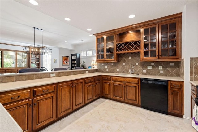 bar featuring black dishwasher, recessed lighting, a sink, and tasteful backsplash