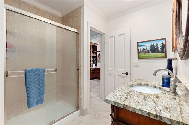 bathroom featuring vanity, ornamental molding, and a stall shower