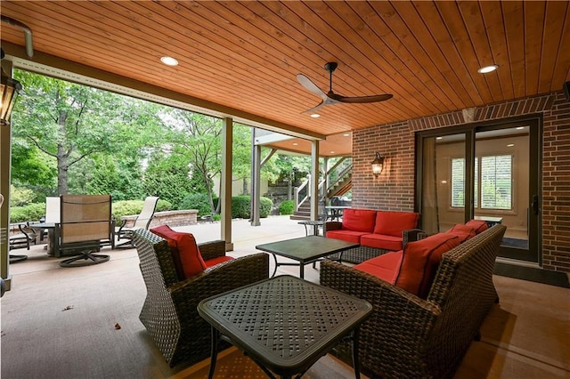 view of patio with ceiling fan, outdoor lounge area, stairway, and outdoor dining space