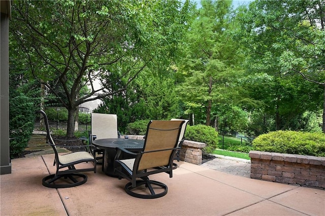 view of patio with fence and outdoor dining space