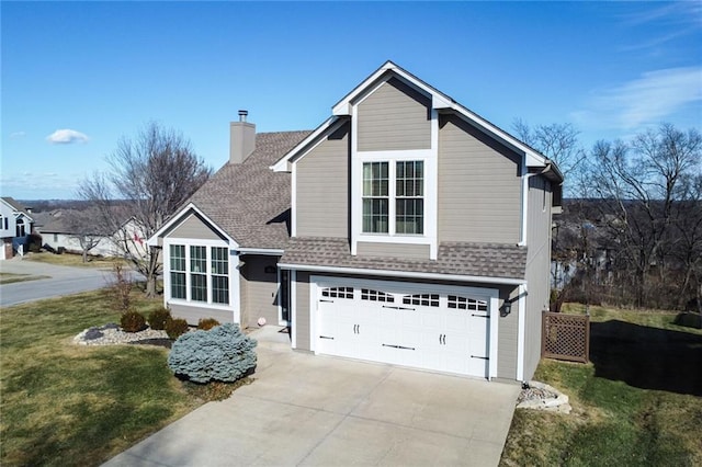 traditional-style home featuring a front lawn, roof with shingles, a chimney, driveway, and an attached garage