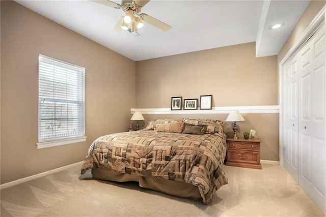 bedroom with a closet, carpet, and baseboards