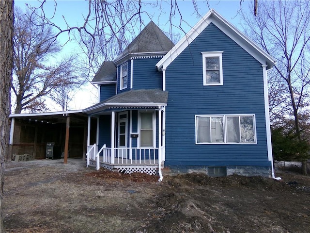 exterior space featuring a porch and roof with shingles