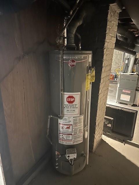 utility room featuring gas water heater