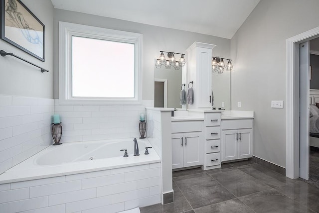 bathroom featuring vanity and a tub with jets