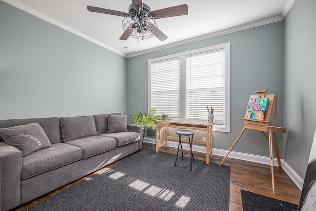 living room featuring crown molding, wood finished floors, baseboards, and ceiling fan