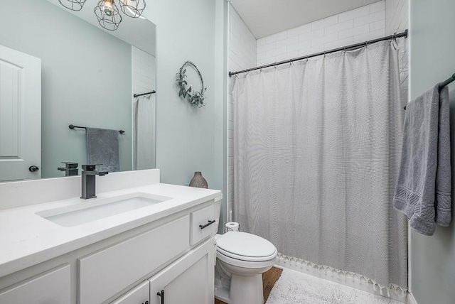 full bathroom with vanity, toilet, and a shower with curtain