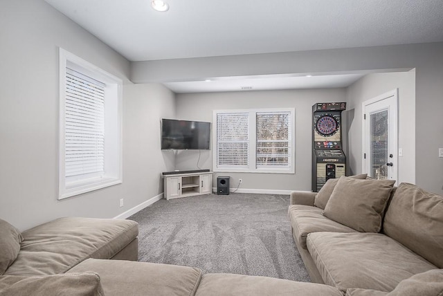 living area with recessed lighting, baseboards, and carpet floors