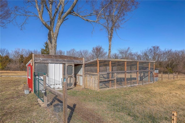 view of poultry coop with a yard