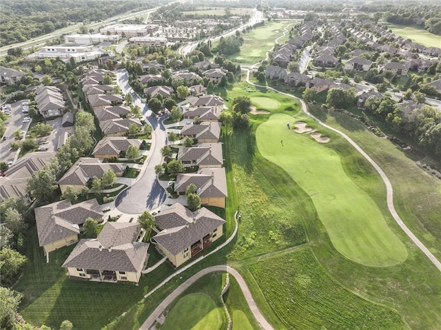 bird's eye view with view of golf course and a residential view