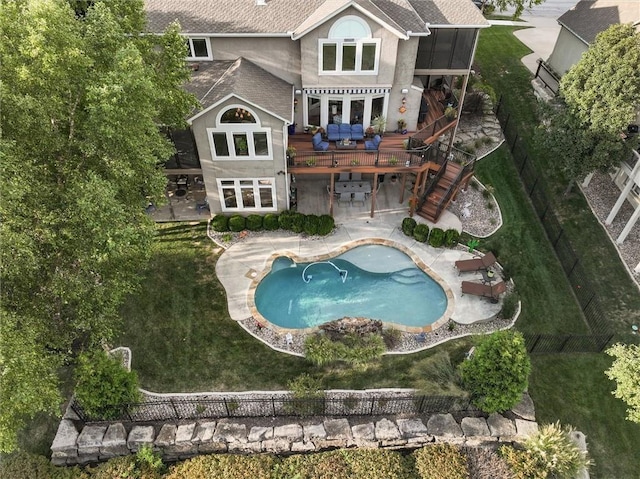 rear view of house featuring a shingled roof, stairway, a deck, a patio area, and stucco siding