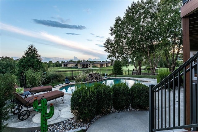 view of pool featuring a fenced in pool, a patio area, and fence