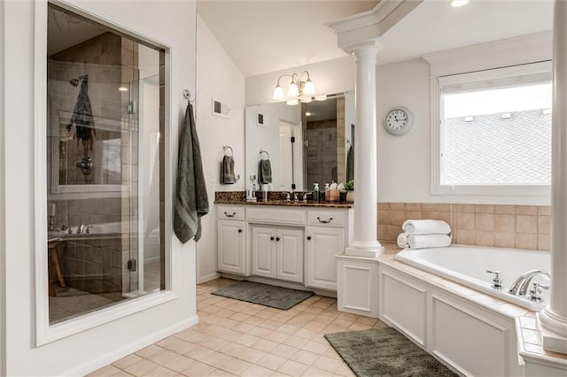 bathroom featuring a shower stall, visible vents, and ornate columns