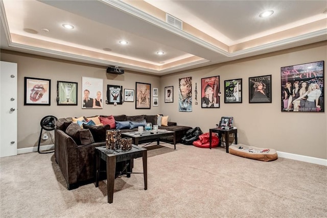 carpeted cinema room with baseboards, visible vents, a raised ceiling, and recessed lighting