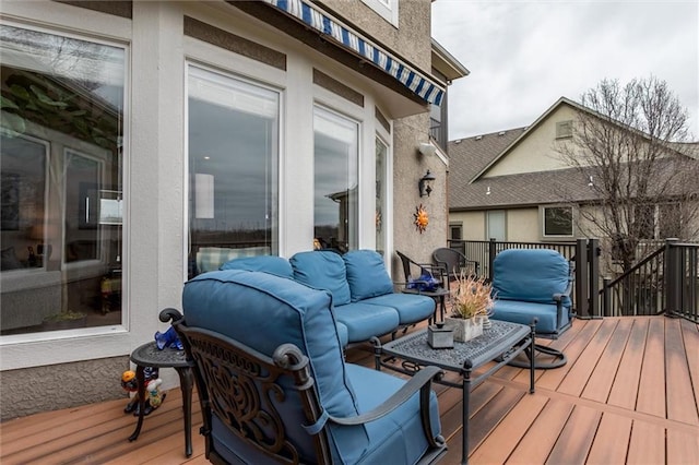 wooden terrace with outdoor lounge area