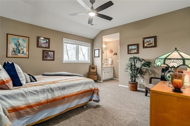 bedroom with light colored carpet, visible vents, connected bathroom, vaulted ceiling, and baseboards