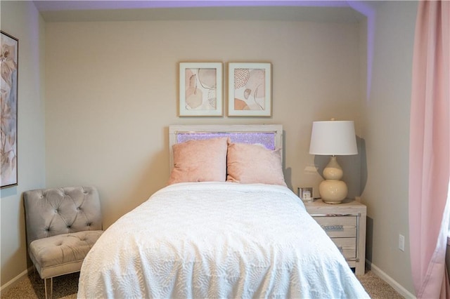 carpeted bedroom with baseboards