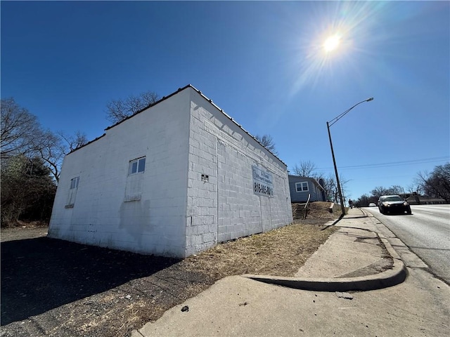 exterior space featuring concrete block siding