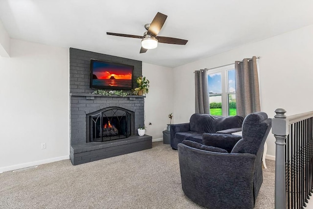 living area featuring a brick fireplace, carpet flooring, and baseboards