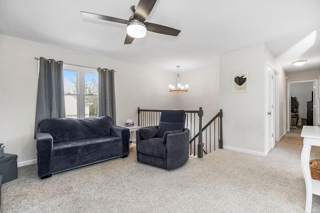 living room featuring baseboards, carpet, and an inviting chandelier