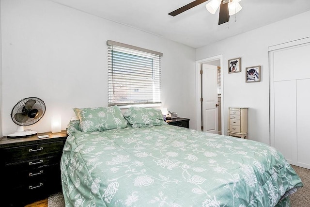 bedroom with carpet floors, ceiling fan, and a closet