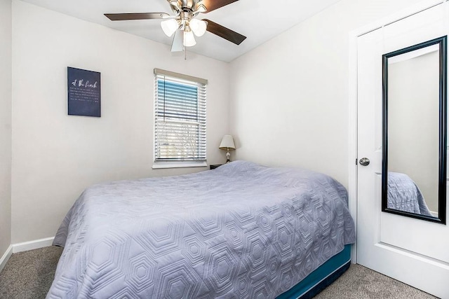 bedroom featuring carpet floors, a ceiling fan, and baseboards