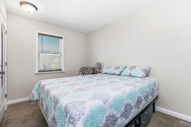 bedroom featuring carpet flooring, visible vents, and baseboards