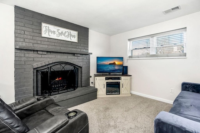 carpeted living area featuring visible vents, a fireplace, and baseboards