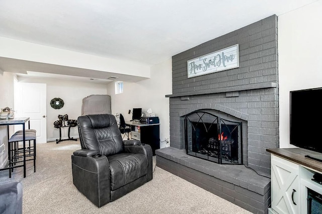 carpeted living room with a fireplace and baseboards