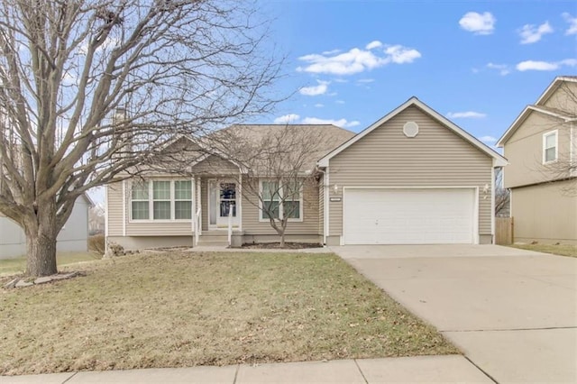 single story home featuring a front yard, concrete driveway, and an attached garage