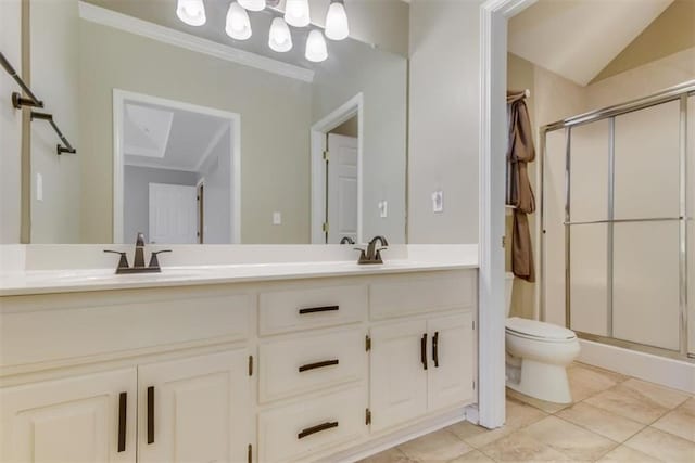 full bathroom featuring toilet, a stall shower, double vanity, and a sink