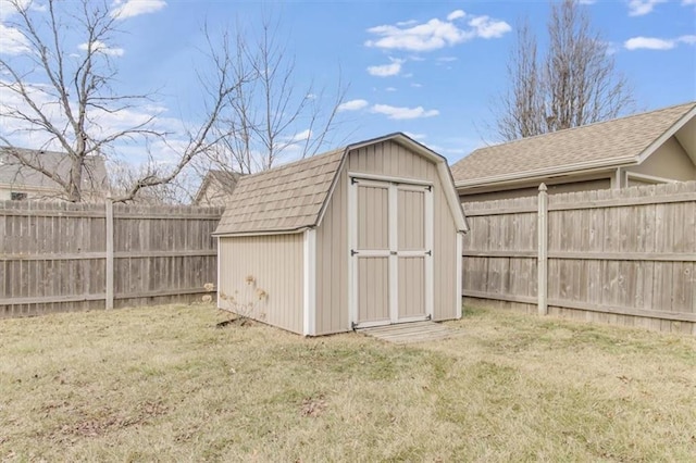 view of shed featuring a fenced backyard