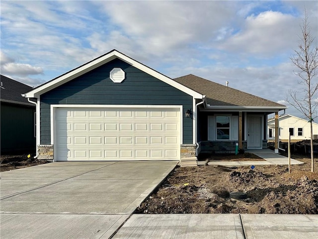 single story home featuring a garage, stone siding, driveway, and a shingled roof