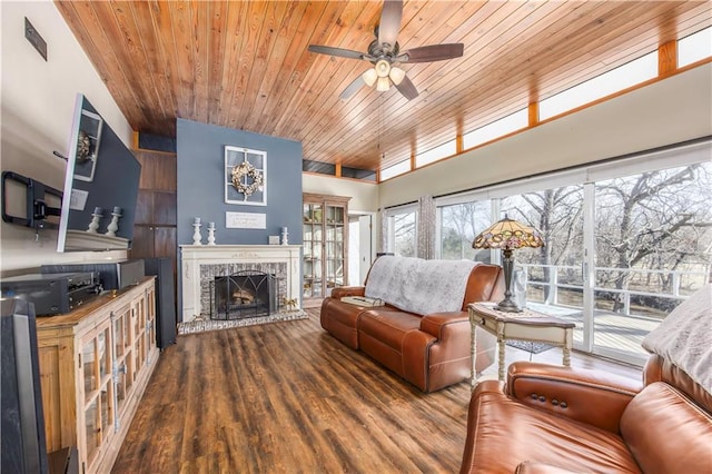 living area featuring wooden ceiling, a fireplace, ceiling fan, and wood finished floors