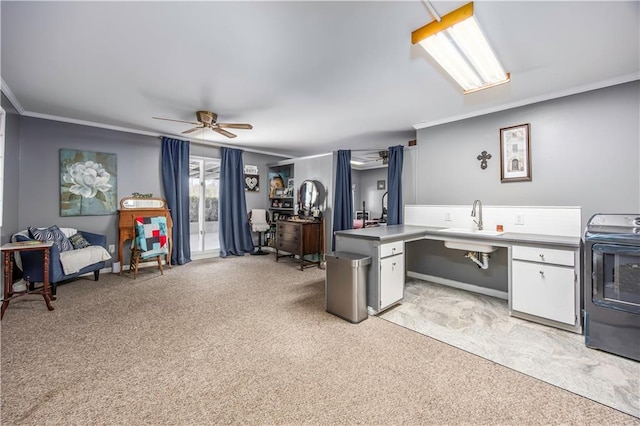 kitchen with crown molding, ceiling fan, light carpet, white cabinetry, and range