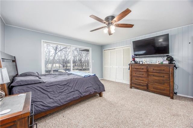 bedroom featuring a closet, ceiling fan, and carpet floors