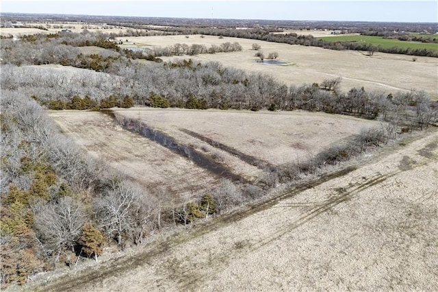 birds eye view of property featuring a rural view