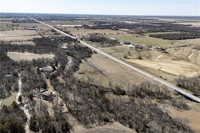 birds eye view of property with a rural view