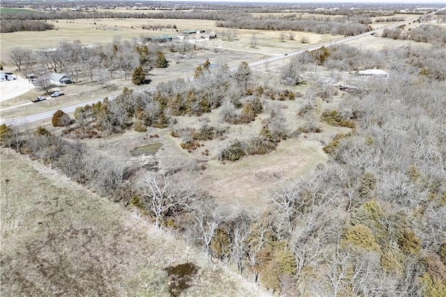 birds eye view of property featuring a rural view