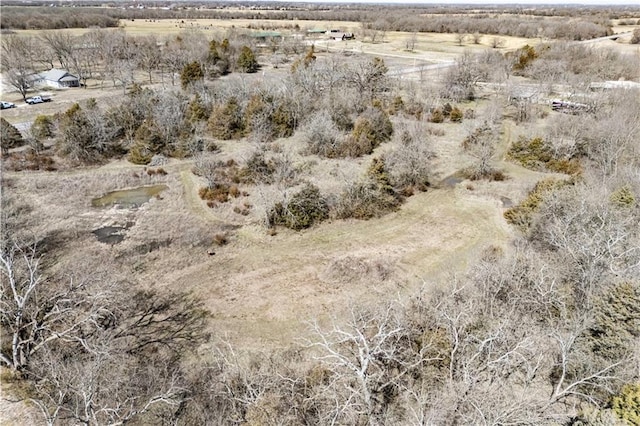 birds eye view of property with a rural view