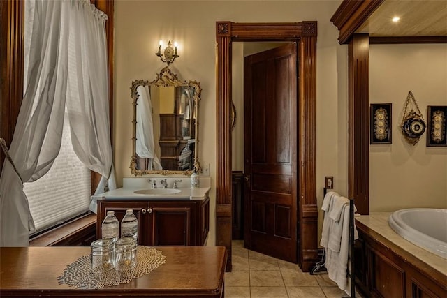 full bathroom featuring tile patterned flooring, vanity, and a tub