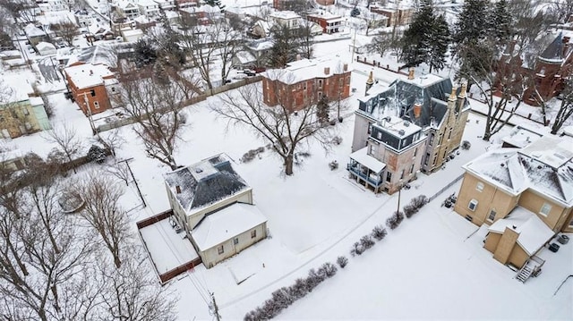 snowy aerial view with a residential view