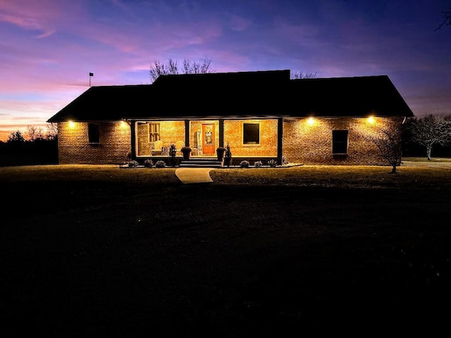 view of back of property at dusk