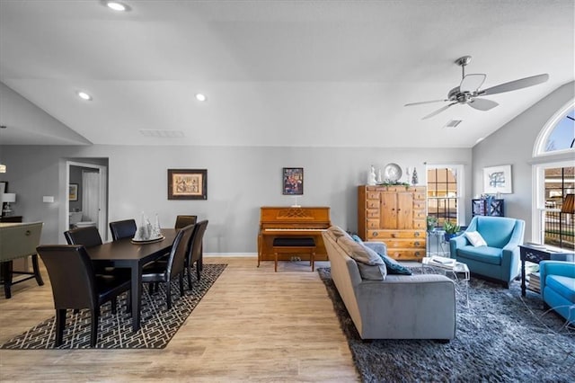 living area with baseboards, ceiling fan, vaulted ceiling, light wood-type flooring, and recessed lighting