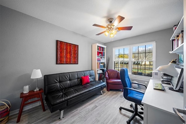 office featuring ceiling fan and wood finished floors