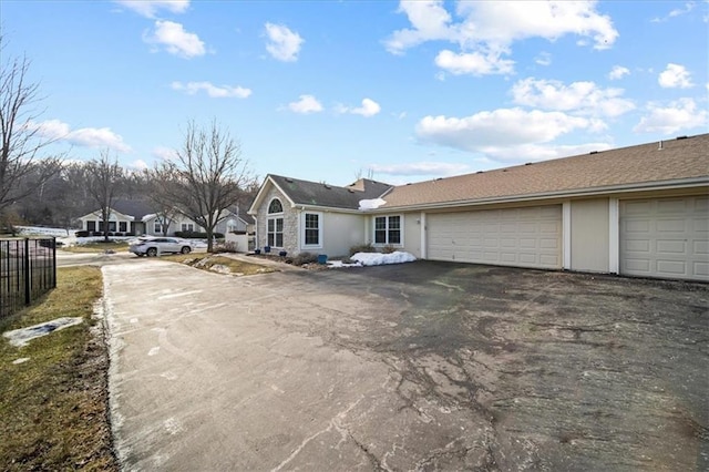 exterior space with driveway and stucco siding