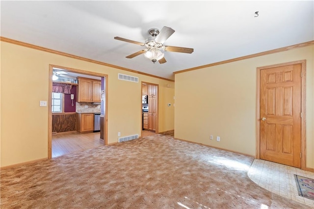 unfurnished room featuring visible vents, ceiling fan, and light carpet