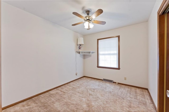 unfurnished room featuring light colored carpet, visible vents, ceiling fan, and baseboards